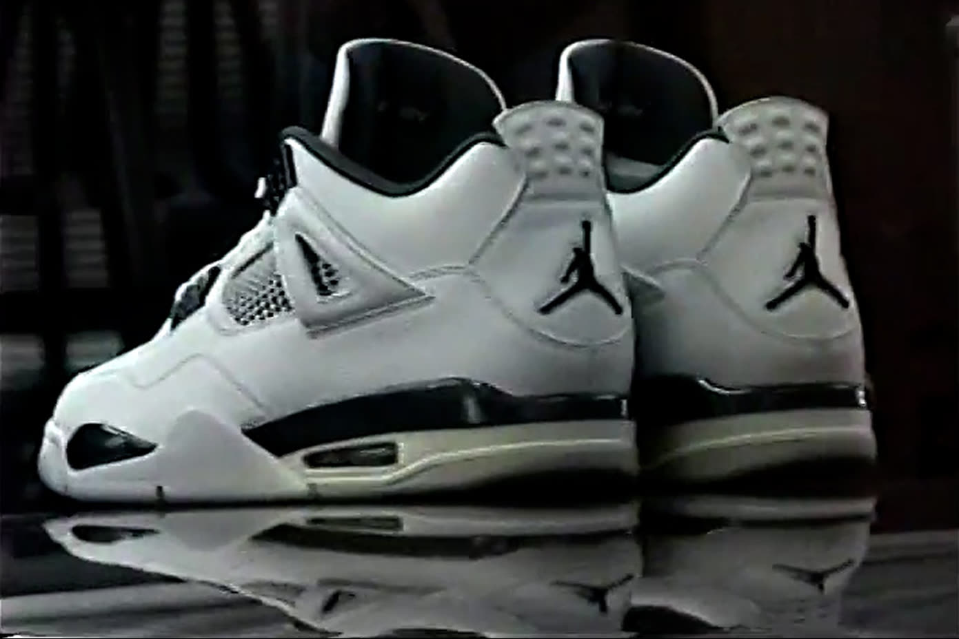 Air Jordan 4 white shoes and reflection